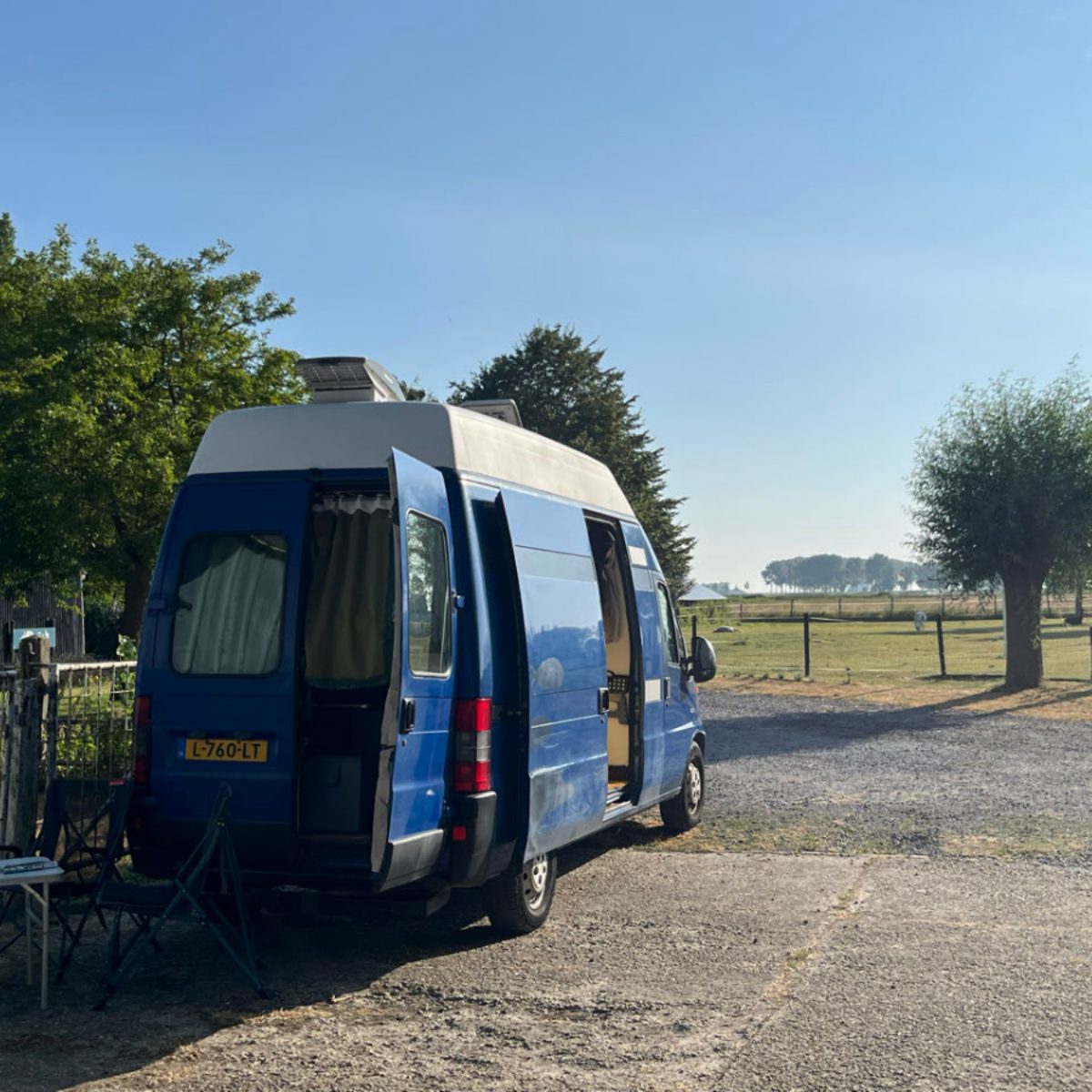 Van parked on the farm-stead.
